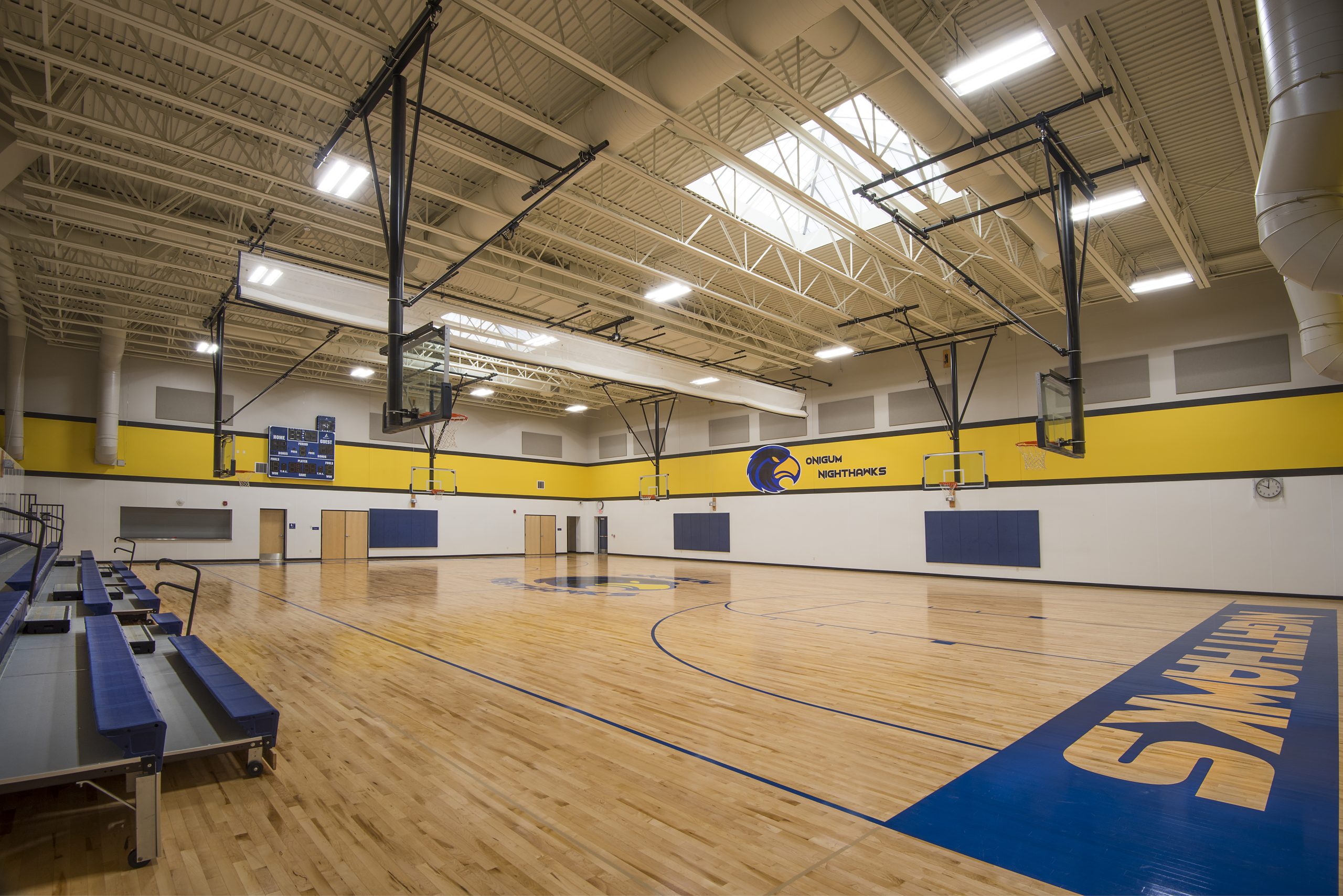 The gym features 13 foot skylights and seating for 150 spectators.