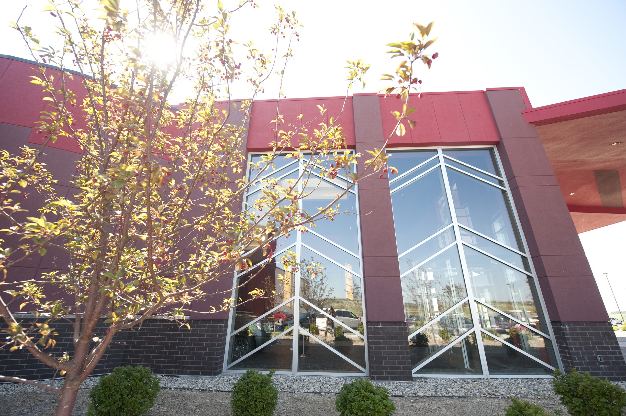 The feather theme is repeated in the lobby’s slate tile floor, and in the steel insets in the lobby’s glass windows.