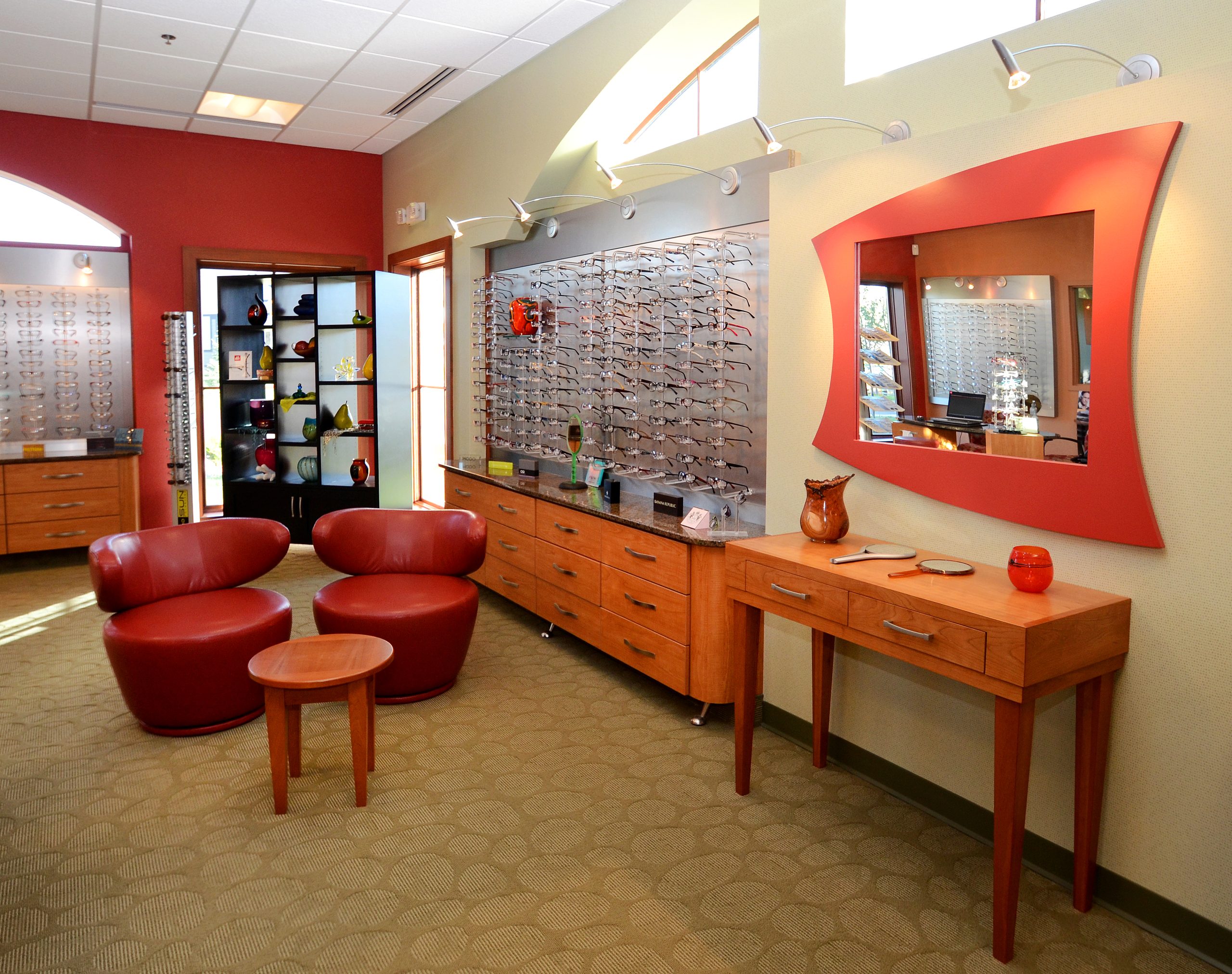 Special display considerations are found in the retail and fitting area from modern storage compartments to additional seating for an interactive experience.