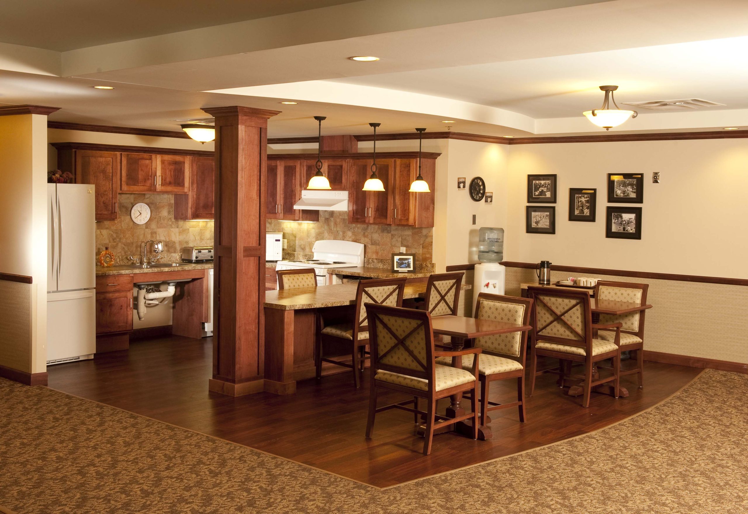 The kitchen features all wood cabinets and a roll-under sink providing accessibility for wheelchairs.