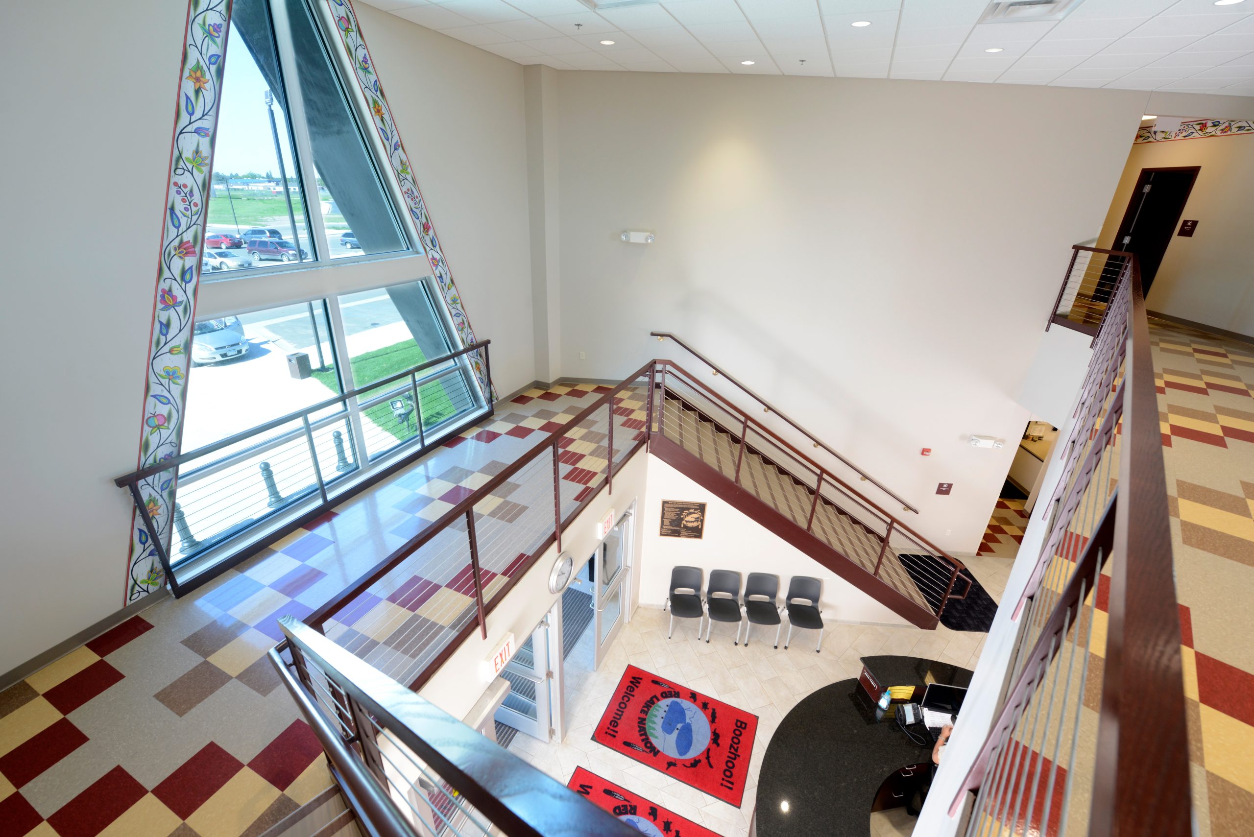The receptionist at the front desk is able to monitor the comings and goings on the open staircase.