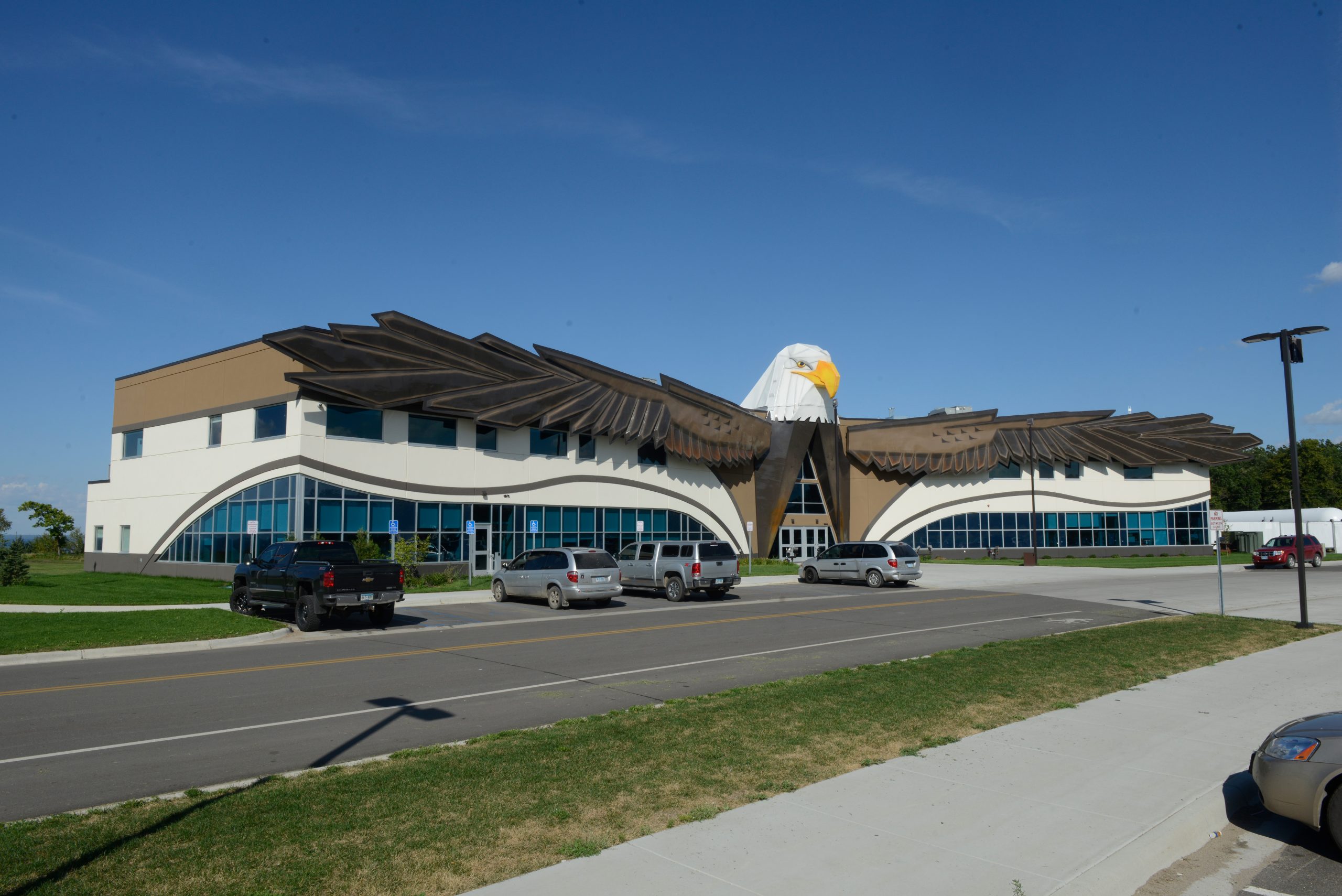 The building itself below the fiberglass eagle, has structural components that also mimic the shape and color of an eagle.