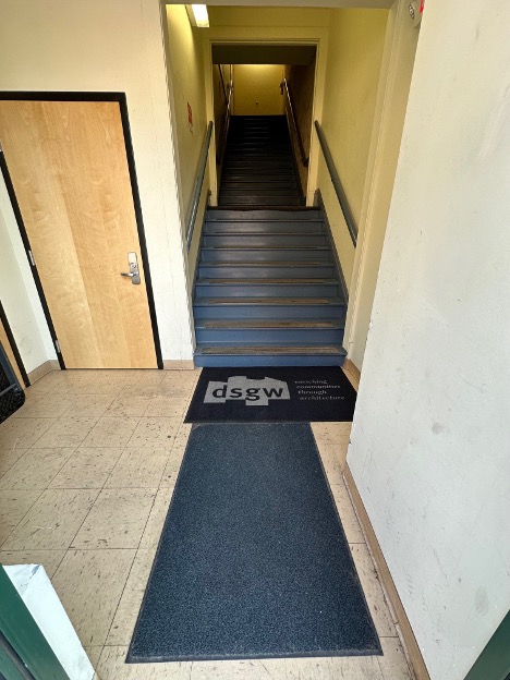 Safety first! Duluth is ripe with snow and ice in the winter, our side stairwells can get slippery, hence the mats and of course, branding.