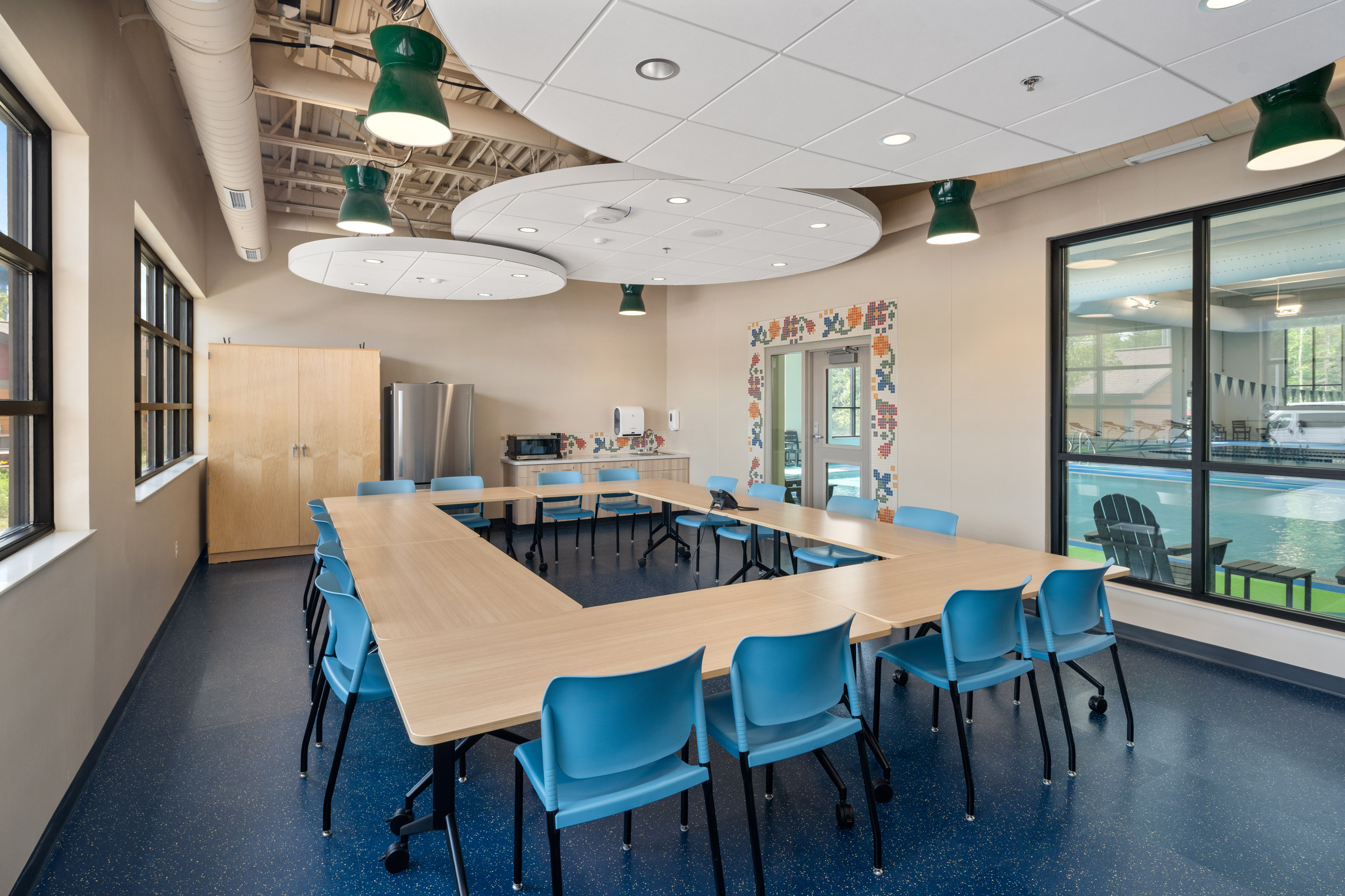 New community room overlooks the aquatic center, for meetings and group gatherings.