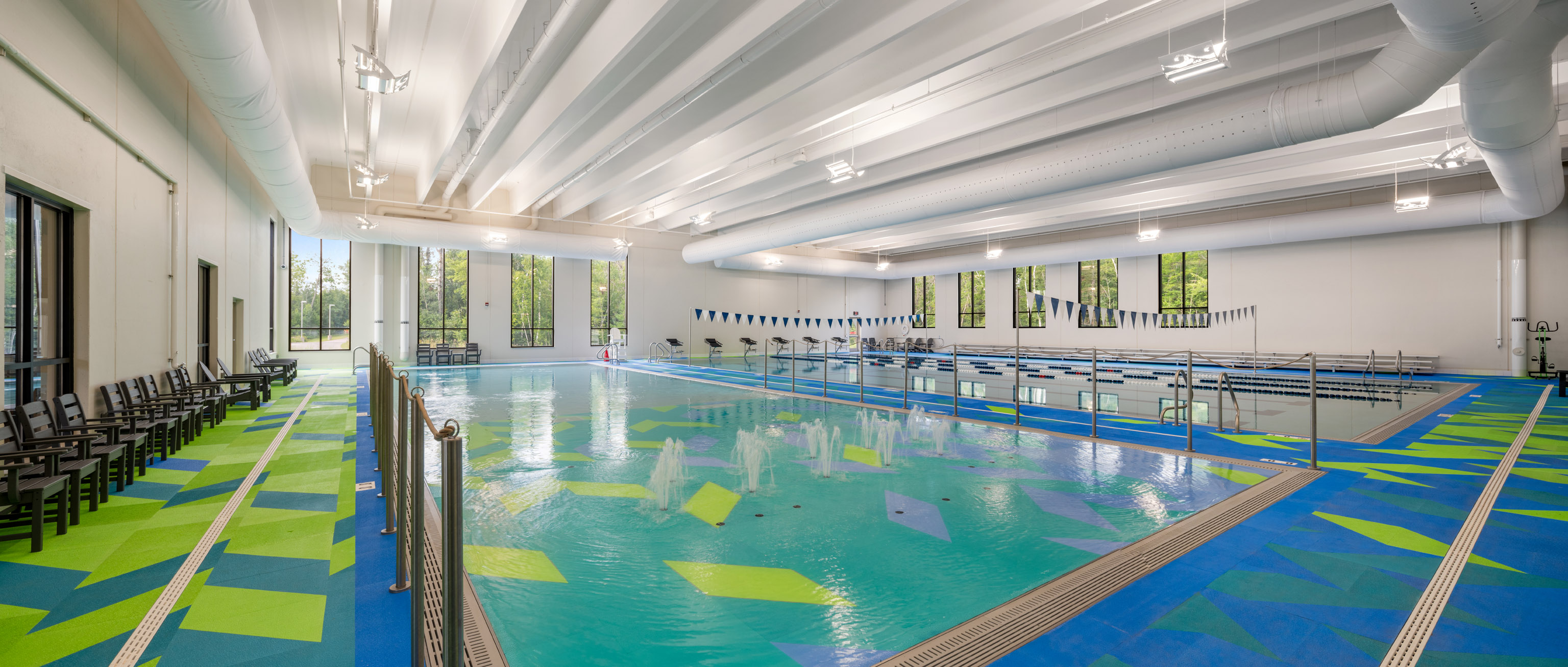 Aquatic center with a 6 lane pool that features a splash pad, zero entry, sauna, locker rooms, and bleachers.