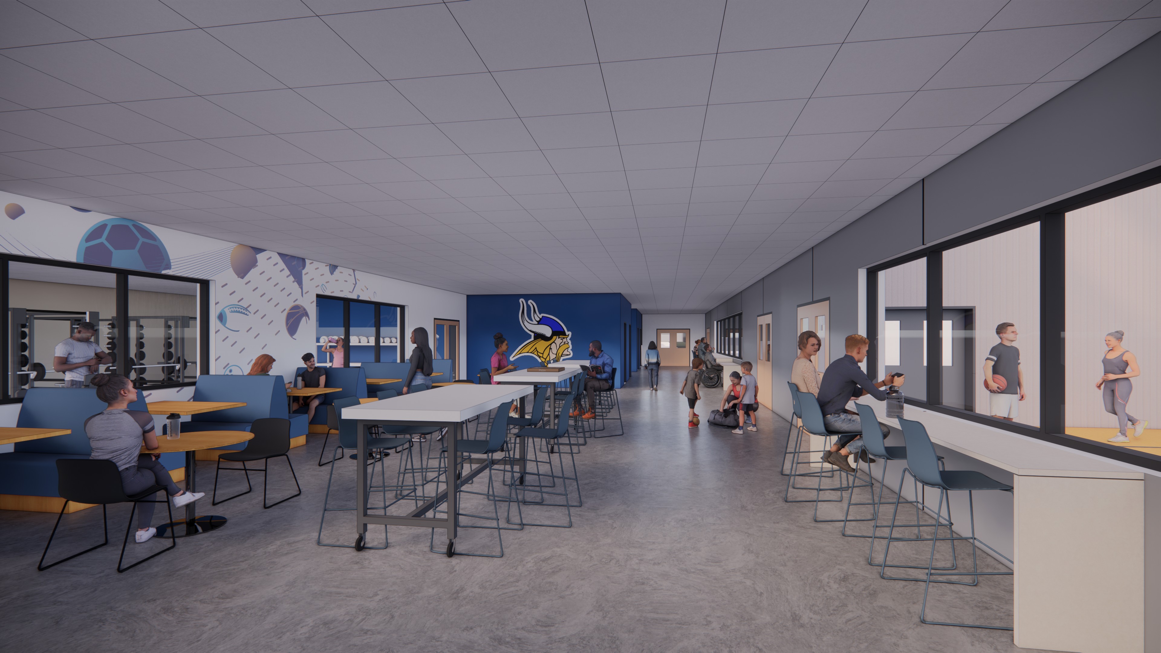 A modern recreation center lounge with people sitting at tables and high counters, watching a gym through large windows; sports-themed wall art and a blue-and-yellow mascot decorate the space.