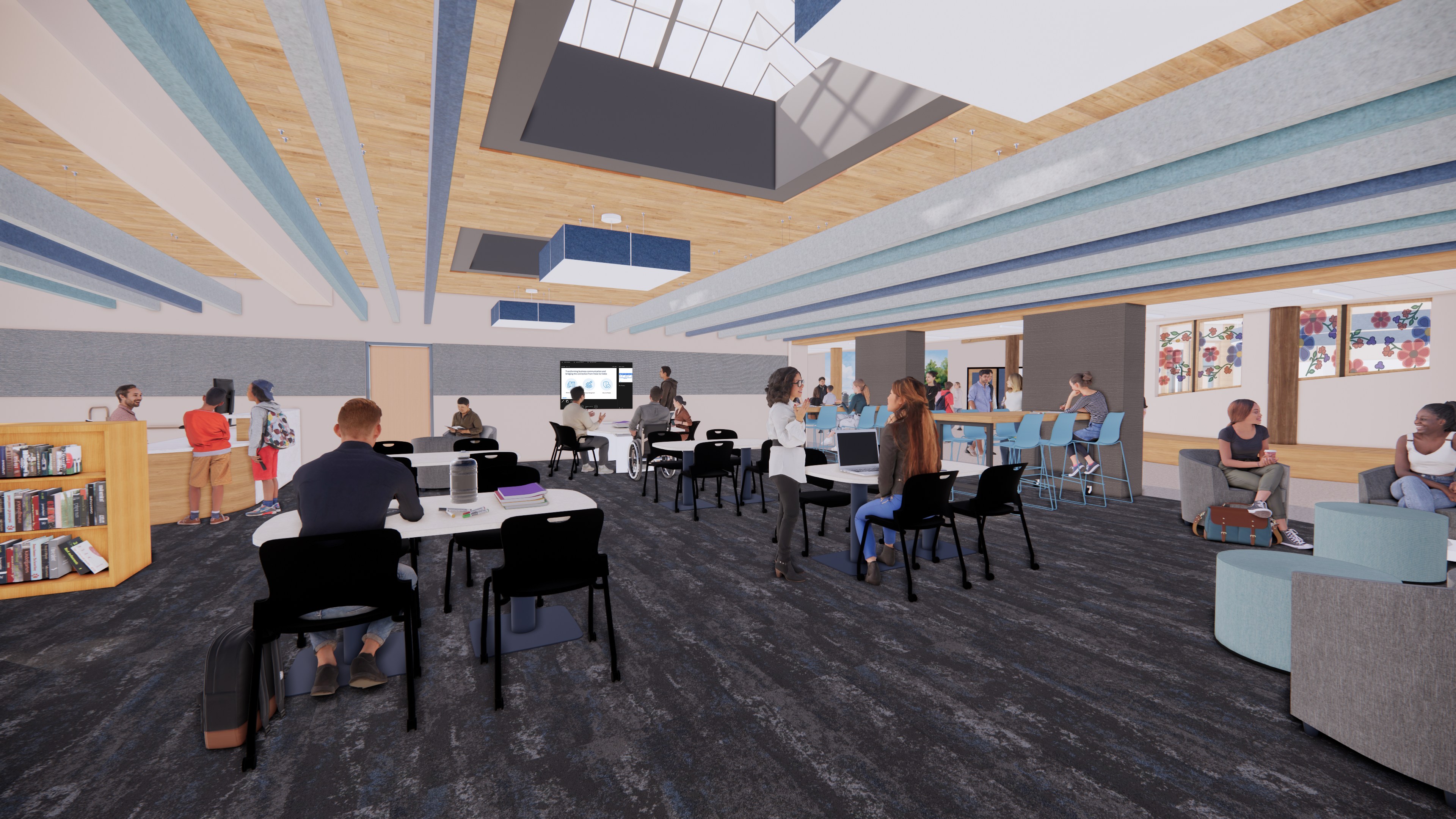 A modern, spacious room with people working, talking, and reading at tables and lounge seating. The room features large windows, bookshelves, colorful artwork, and a wood-paneled ceiling with exposed beams.